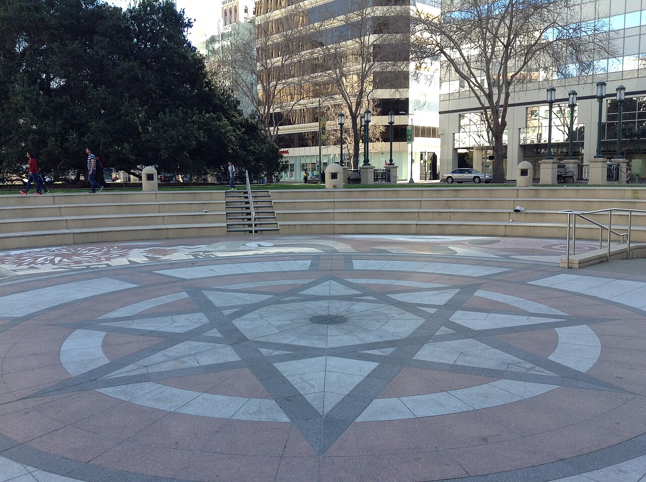 Frank Ogawa Plaza with trees and people in downtown Oakland